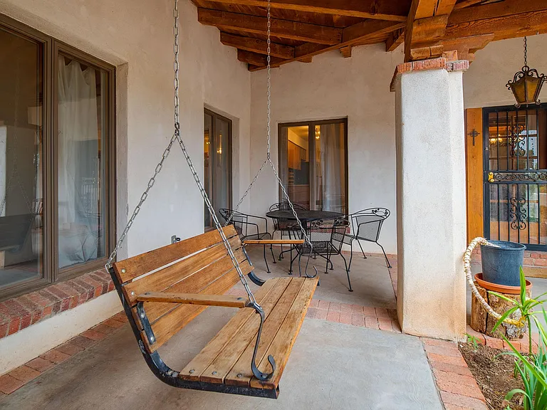 Porch swing and outdoor dining area