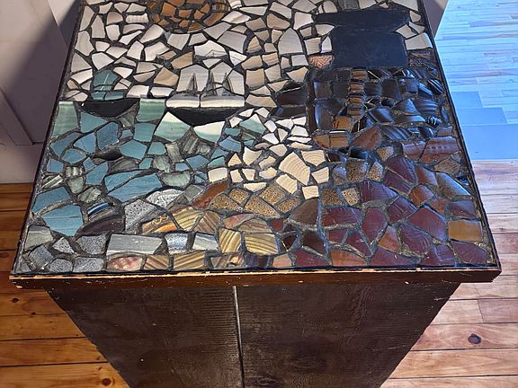 Mosaic Countertop over dishwasher.
