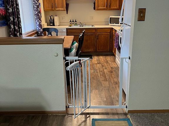 From Family Room looking into Kitchen. Flooring at entry and Kitchen