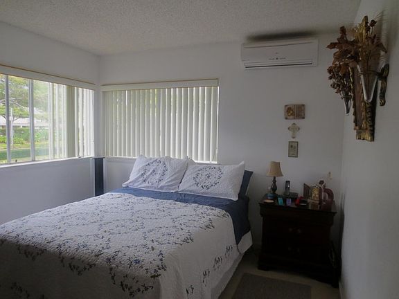 Master Bedroom with Split AC- bed and decor are staged
