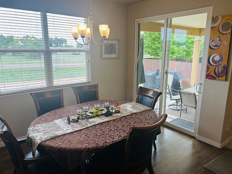 The large glass doors lead out onto a covered patio. An extended concrete slab allows for you BBQ and smoker to sit away from guests. Should you want a fence please communicate this!