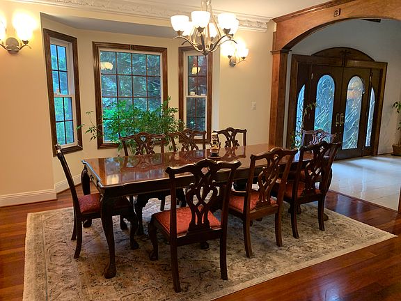 Dining Area with oversized windows and beautiful views of the surrounding landscape while filling the home with abundant natural light!!