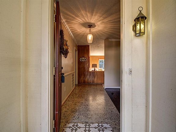 Come on in for your personal tour. The entry has original terrazzo tiles.