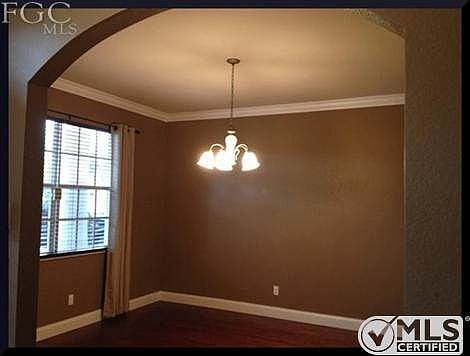 Large Dining Room with window coverings!