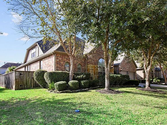 This provides a better view of the large corner lot, with no neighbor on this side.