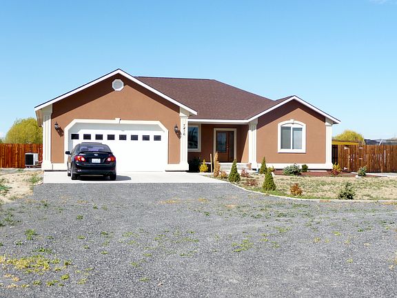 Front of the property with a circular driveway