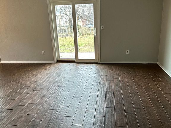 Large Living room/den area - patio doors look to the East.