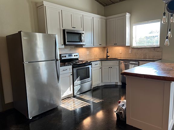Remodeled kitchen, added some cabinets and painted.