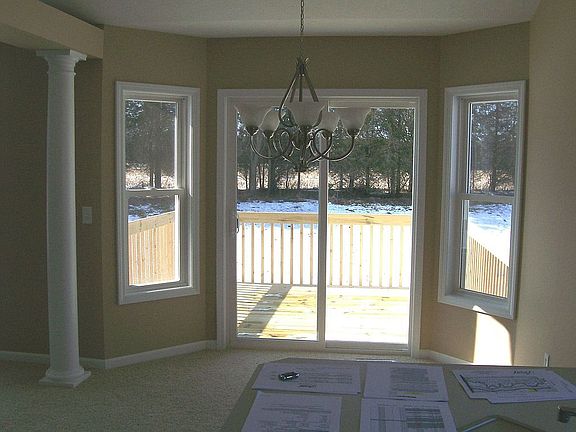 Dining area wiith bay sliders to private deck
