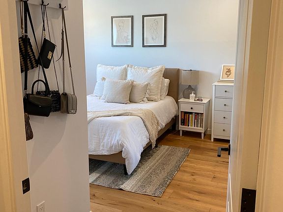 Bedroom 2 by downstairs past staircase and next to downstairs bathroom.