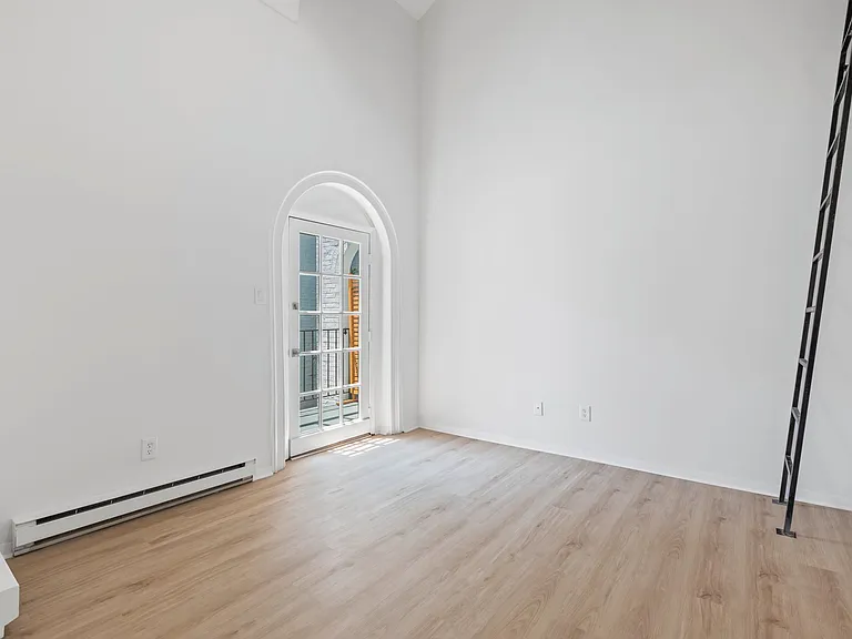 Arched bedroom doorway to private balcony for 3rd floor units