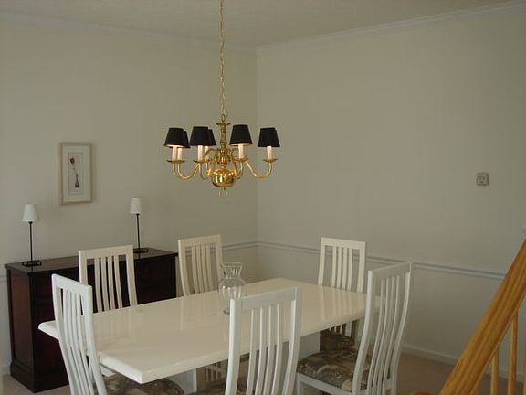 Crown moulding & chair rail lend a feeling of opulence to the dining room.