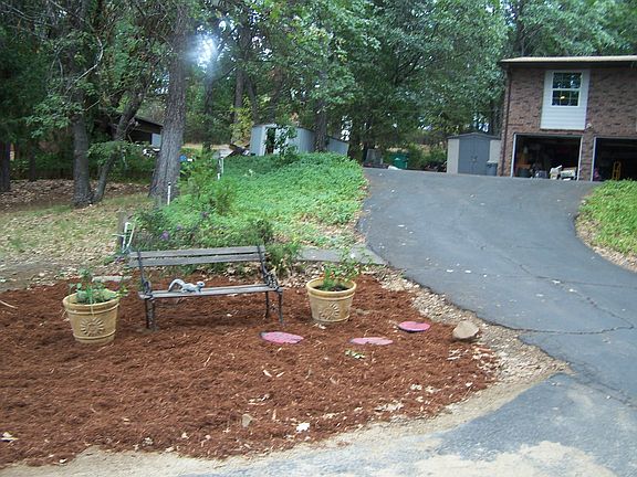 Brick house at top of driveway.