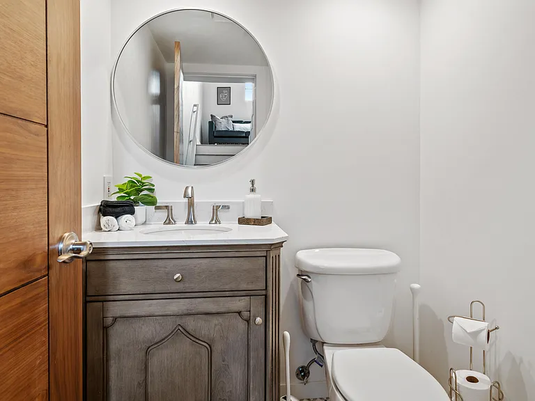 Chic and stylish half bathroom, a petite yet powerful space that packs a punch in terms of design and functionality.