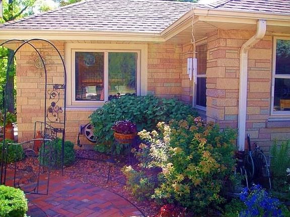 Brick patio with gorgeous plantings!