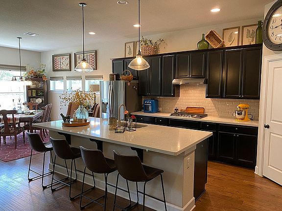 Kitchen with bar and dining