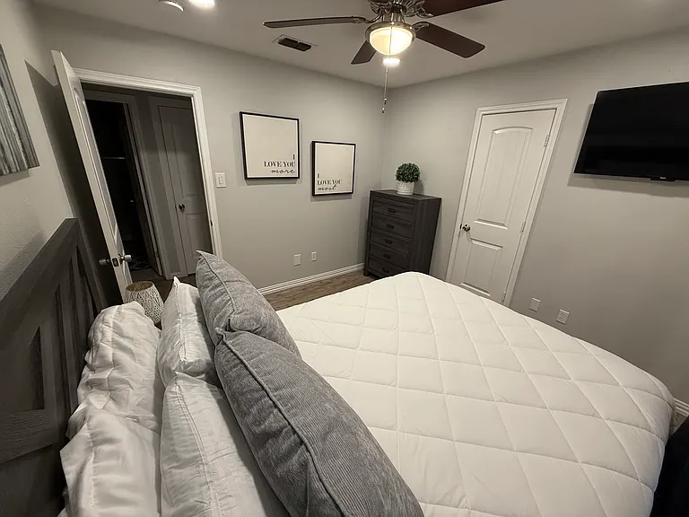 Bedroom 2 - a queen bed and smart tv.