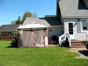 The patio is now covered with a charming gazebo cover that the owner agrees to leave with the property for the next owner to enjoy.