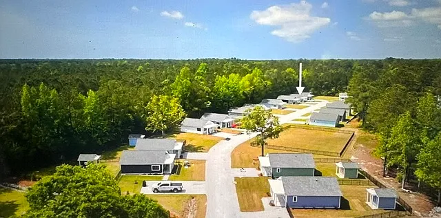 Newer home located at the back of the community backing up to woods