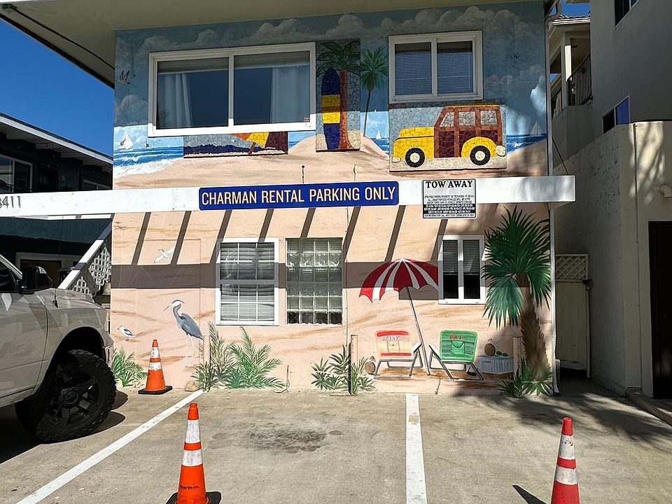 Front of building with off street parking. Studio is top front apartment