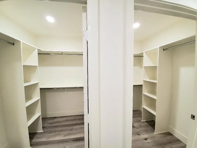 Rear master bedroom double walk-in closets