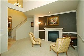 Formal living, double sided fireplace, crown and chair rail