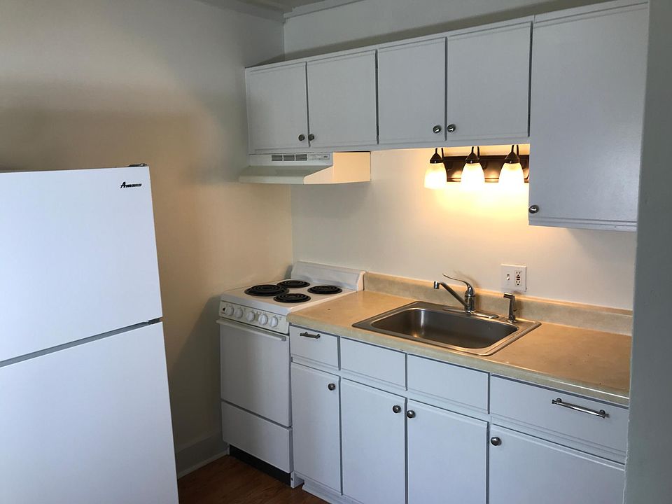 Kitchen with full size fridge.