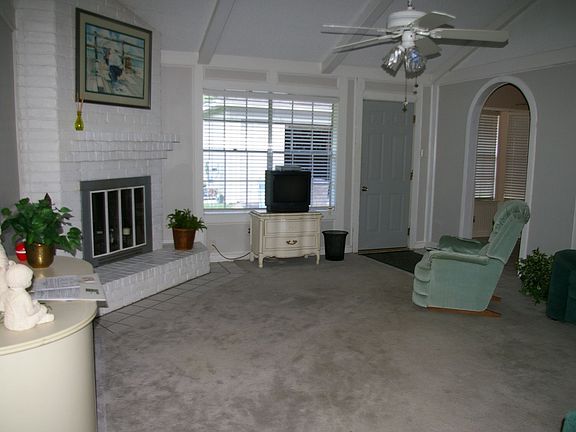 Spacious living area with cozy wood burning fireplace