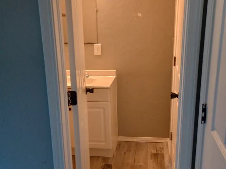 Entry to bathroom from bedroom.