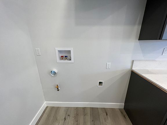 Stack laundry hookups and refrigerator water hookup