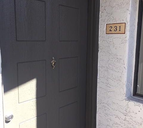 Front door. Steps leading to second floor only go to this condo.