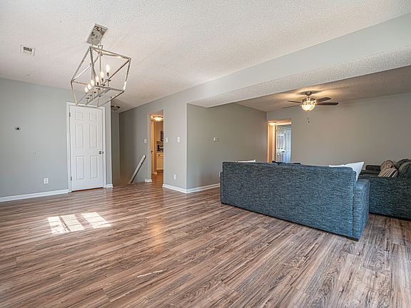 Dining and living room area. Furniture available for purchase.