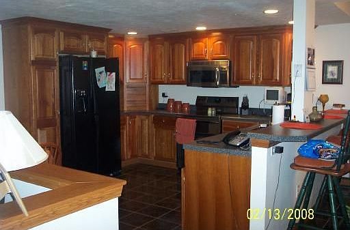 Kitchen: Lower-level (in-Law) custom cherry kitchen with appliances included (