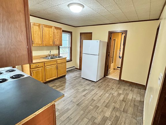 Kitchen with vinyl flooring.