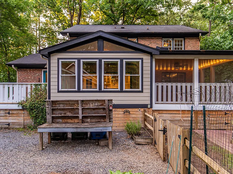 Rear of the house with garden bench.