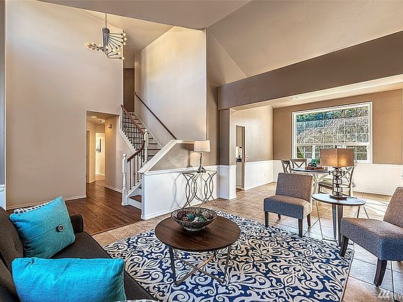 Gorgeous Two-Story Foyer Welcomes You Upon Entering The Home.  Newly Refinished Oak Hardwood Floors, New Interior Paint, And New Lighting Fixtures Throughout The Home.  New Wrought Iron And Hardwood Floor Staircase.
