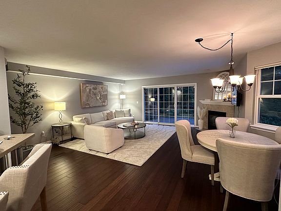 Open layout living room with bamboo flooring and outdoor deck facing nature. Ample storage and great privacy.