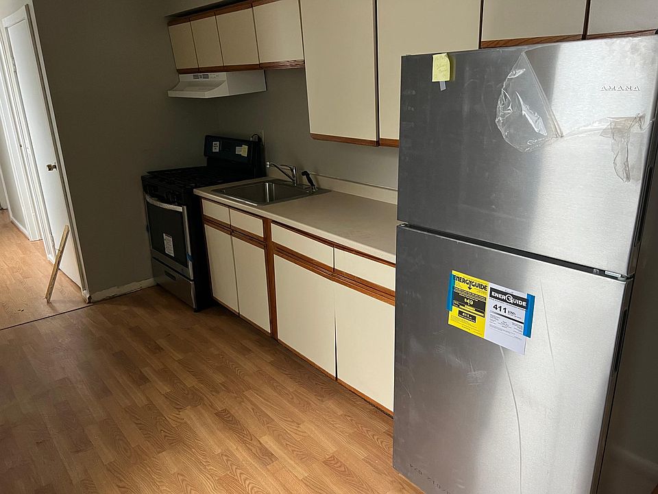 kitchen with new fridge and stove