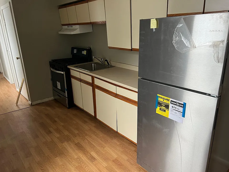 kitchen with new fridge and stove
