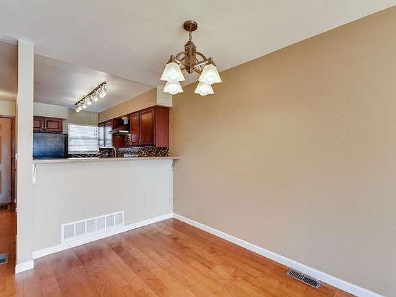 DIning room with dimmable chandelier.