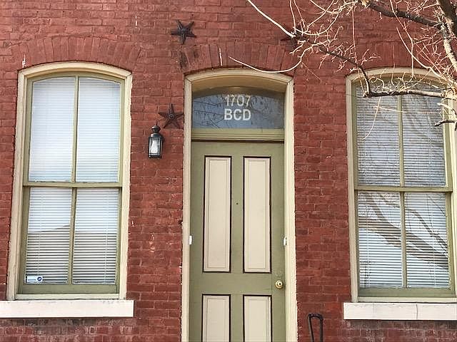 1st floor unit, 10 ft ceilings, brick accent wall.