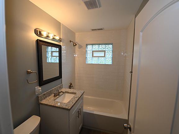 BATHROOM - ALL NEW FIXTURES AND SUBWAY TILES IN THE TUB/SHOWER!