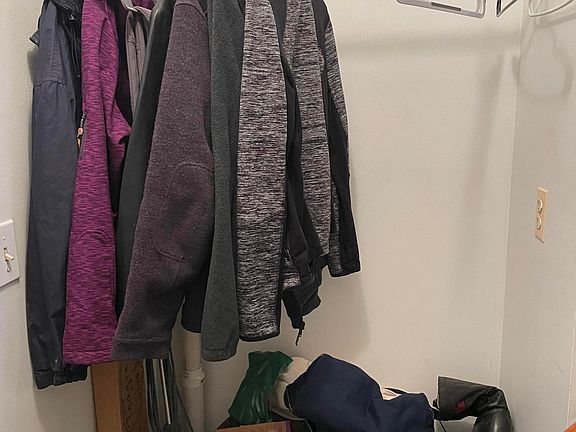 Storage at the bottom of the stairs