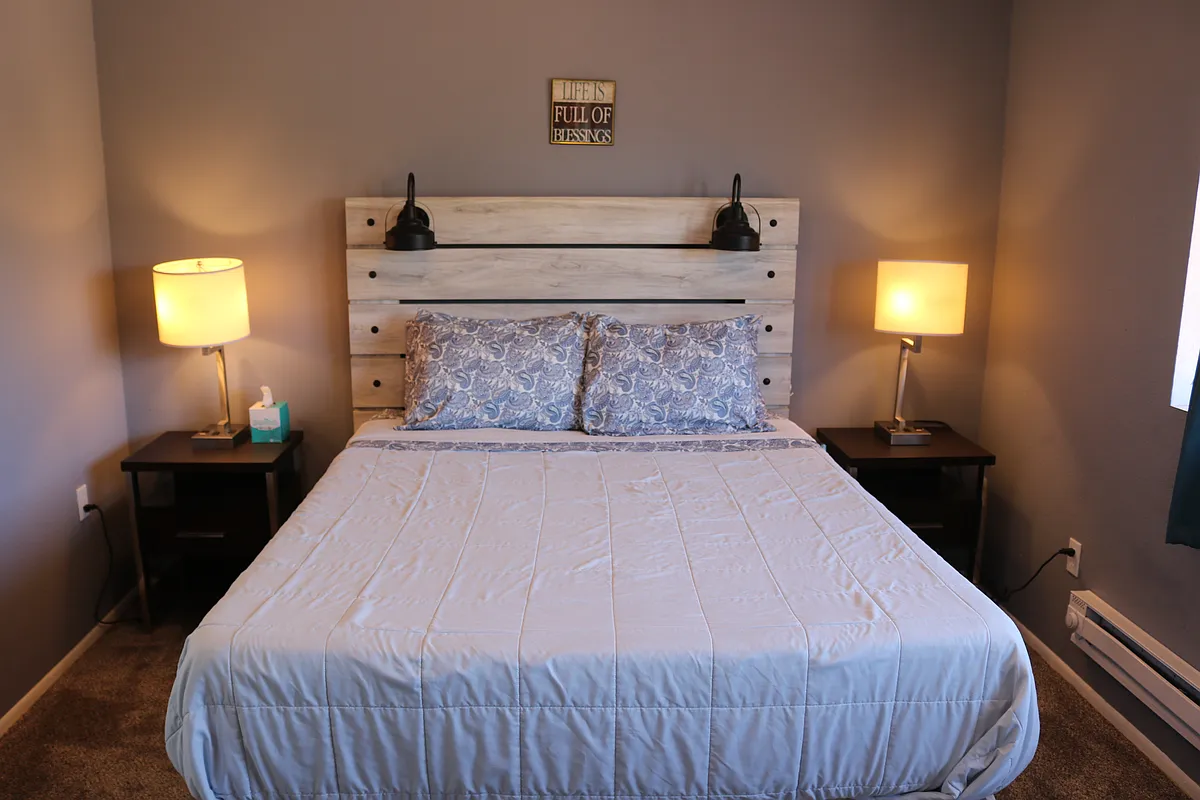 Master bedroom with nightstands. This queen bed has a memory foam mattress (medium soft). Linens provided, or bring your own. - 25 E Lexington