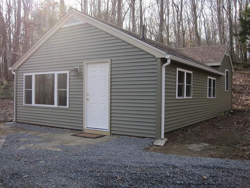 FRONT OF HOUSE WITH DINING AREA WINDOWS