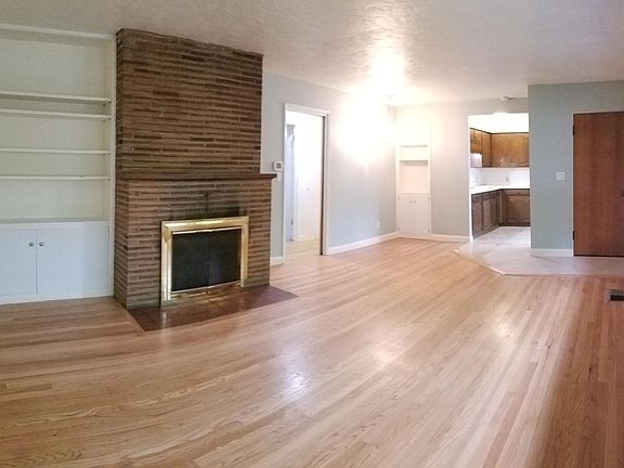 Living room view to kitchen and hall