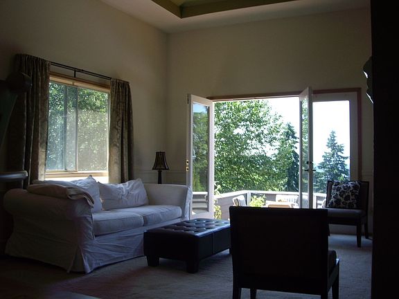 Living Room with Step Down Deck. Beautiful View!
