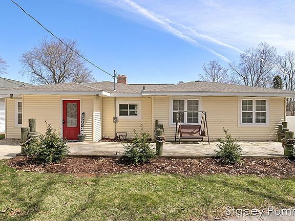 Front of home, short drive to left of front door, very long drive to right of front door.