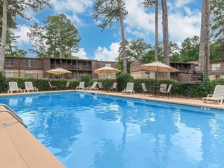 Welcome to Guest House, where relaxation meets luxury. Soak up the sun by our sparkling pool surrounded by lush landscaping and inviting lounge areas. Ideal for unwinding or socializing. Reserve your spot today and elevate your lifestyle!