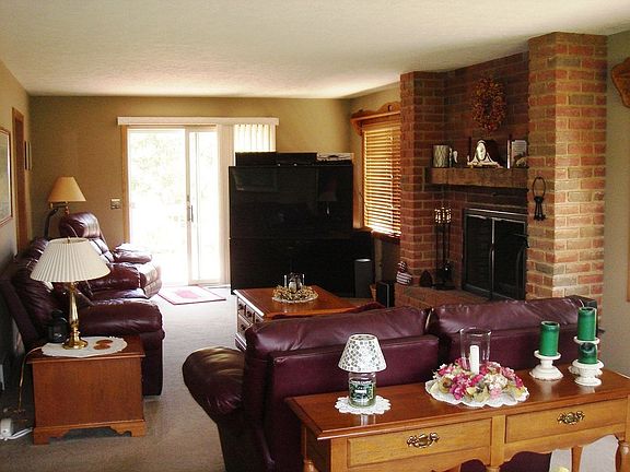 Beautiful brick fireplace creates a cozy, warm atmosphere in the family room.